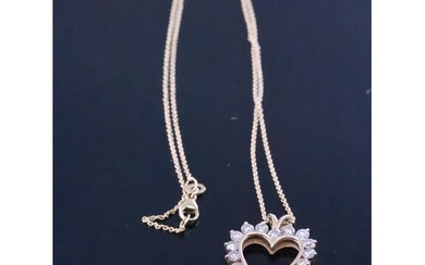 A diamond set heart pendant on an 18ct gold chain approx. 6 ...