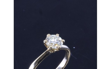 A diamond solitaire ring set in 18ct gold finger size M esti...