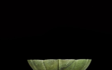 A finely carved spinach-green jade floral-shaped bowl, Qing dynasty, 18th - 19th century | 清十八至十九世紀 碧玉葵式盌