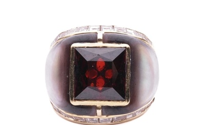 A gem-set cocktail ring, centred with a square scissors-cut ...
