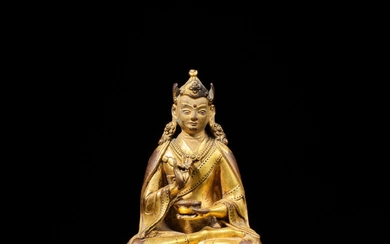 A gilt-copper alloy figure of Padmasambhava, Tibet, circa 16th century