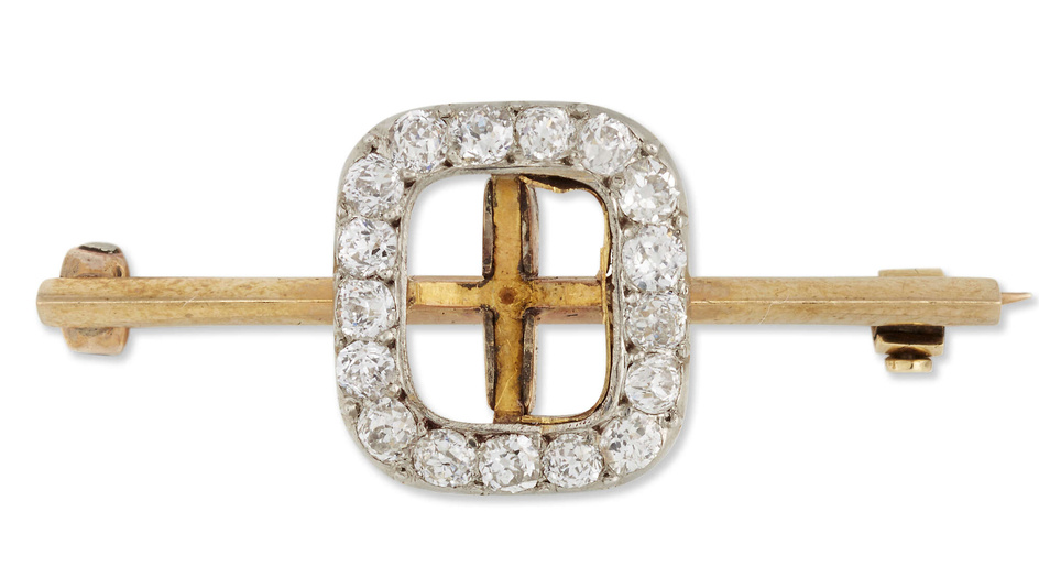 A gold diamond set brooch, a vacant central collet with...
