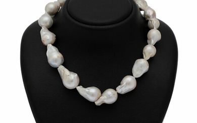NOT SOLD. A graduated pearl necklace set with numerous baroque cultured South Sea pearls and...
