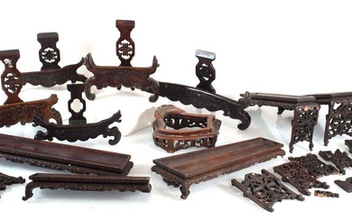A group of Chinese carved hardwood stands and rests (12)...