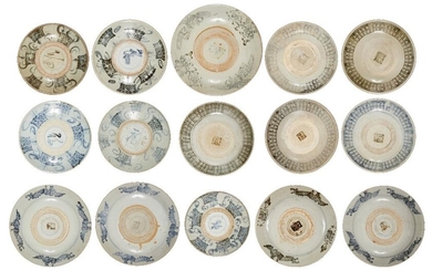 A group of fifteen large Chinese 'Zhangzhou' blue and white plates, 17th to 19th century, variously decorated with phoenix in flight, characters and basket weave designs, all with unglazed well, the largest 34.5cm diam. (15). 十七-十九世紀 漳州窯青花盤一組十五件