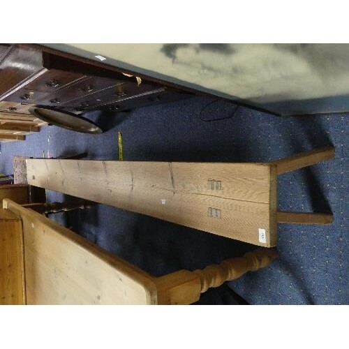 A large 20thC pine Bench, 97in (246cm) long x 9in (23cm) dee...