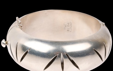 A large Mexican modernist sterling silver hinged bangle, wit...
