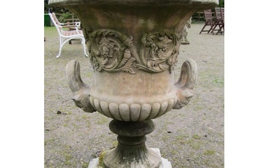 A large cast composition stone campana shaped garden urn wit...