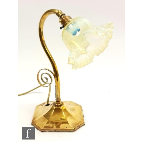 A late 19th Century Arts and Crafts style brass table lamp w...