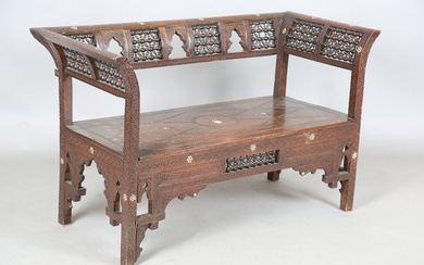 A late 19th century Middle Eastern hardwood and mother-of-pearl inlaid window seat, similar to those
