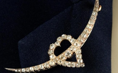 A late 19th century silver and gold old-cut diamond crescent moon and heart brooch.Estimated total