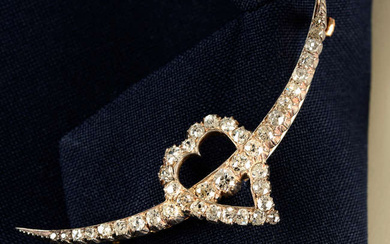 A late 19th century silver and gold old-cut diamond crescent moon and heart brooch.