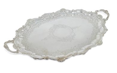 A late Victorian twin-handled silver tray, Sheffield, 1900, Atkin Bros, retailed by JW Benson, of shaped oval form, designed with shell and scroll border to foliate scroll engraved base, 73.5cm long (inc. handles), approx. weight 120oz