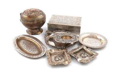 A mixed lot of silver metalware items, comprising: an Egyptian cigarette box, a Far Eastern pot and cover, a tea strainer, two ashtrays and three dishes. (8)