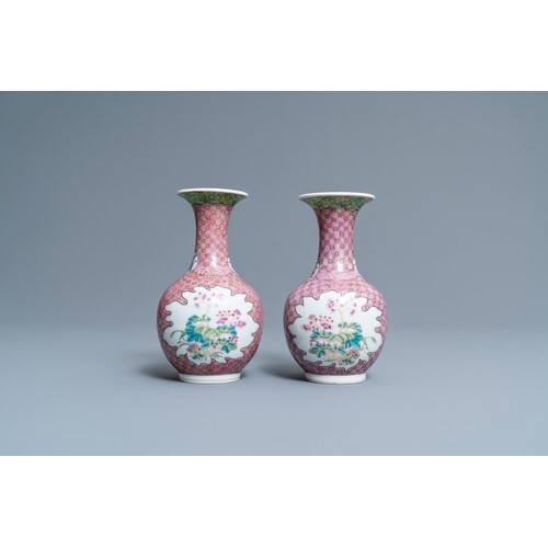 A pair of Chinese famille rose bottle vases with floral desi...