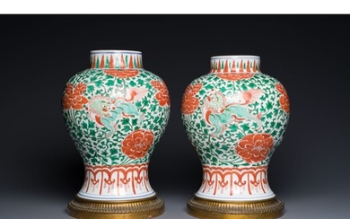 A pair of Chinese famille verte 'Buddhist lion' vases with g...