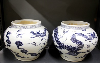 A pair of Chinese hand painted porcelain dragon bowls, Dia. 35cm.