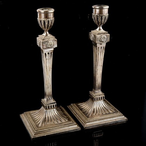 A pair of Dutch silver table candlesticks, fluted decoration...