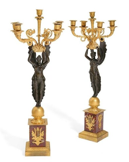 A pair of Empire figural five light candelabra