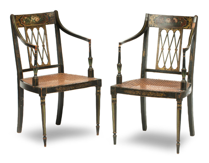 A pair of George III ebonised and floral painted open armchairs