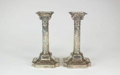 A pair of Victorian silver Corinthian column candlesticks
