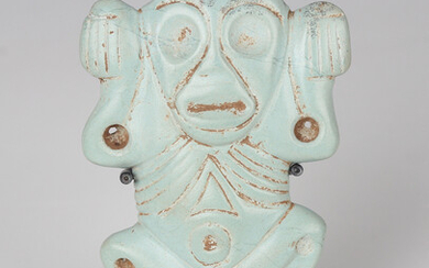 A pre-Columbian Taino style carved pale turquoise coloured stone figural pendant or amulet, probably