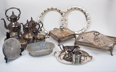 A quantity of silver plate, including: various pierced twin-handled mounts for serving dishes (with covers, liners deficient); a shaped quatrefoil tray; a set of place mats, a tea service and a butter dish (a lot)