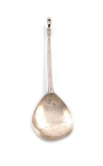 A rare Charles I East Anglian silver Lion Sejant spoon, SI or IS with a pellet below or above, Norwich 1636, fig-shaped bowl, faceted tapering stem, the Lion Sejant finial with traces of gilding, the reverse of the bowl with an old collection label...