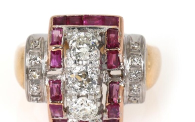 A ruby and diamond ring set with numerous carre-cut encircled by numerous...