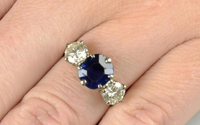A sapphire and diamond three-stone ring. Sapphire
