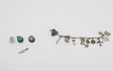 A sterling charm bracelet, and extra sterling charms