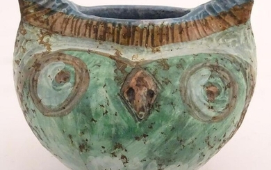 A studio pottery vase formed as the head of an owl.