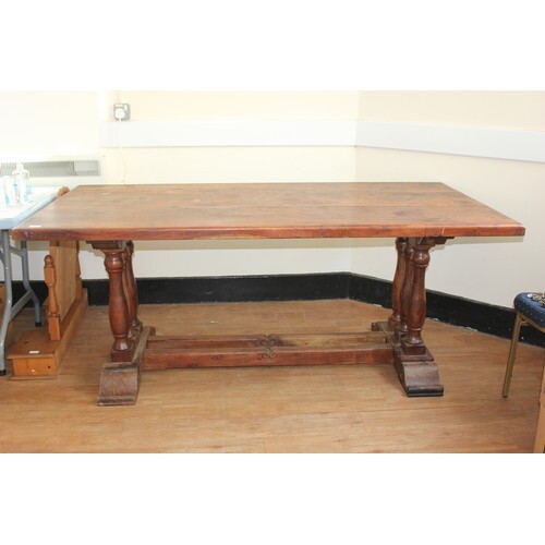 A teak refectory style dining table of continental style, on...