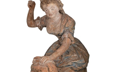 A very large polychrome terracotta sculpture of a woman drying the laundry, 18thC, H 90...