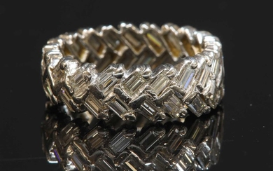 A white gold diamond set band ring