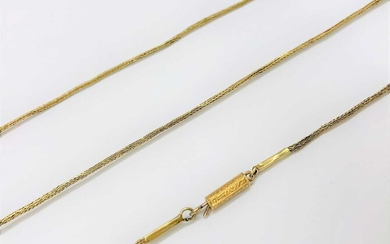A yellow precious metal long chain