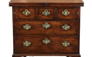 AN EARLY 18TH CENTURY WALNUT BACHELORS CHEST with fold-over...