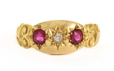 An 18ct gold three stone diamond and ruby set ring