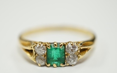 An 18ct, single stone emerald and four stone diamond cluster...