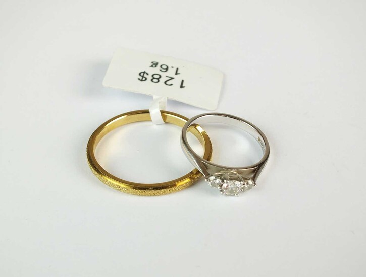 An 18ct white gold three stone diamond ring