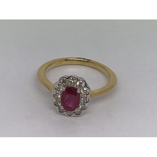 An 18ct yellow gold oval -cut ruby and RBC diamond cluster r...