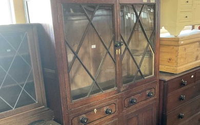 An 18th century oak cabinet with moulded cornice and carved...