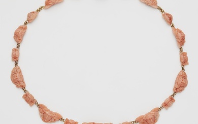 An Archaeological Revival style 18k gold and Sciacca coral cameo necklace.