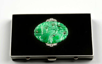 An Art Deco silver, carved jade, emerald, diamond and black enamel vanity case, by Strauss, Allard and Meyer.
