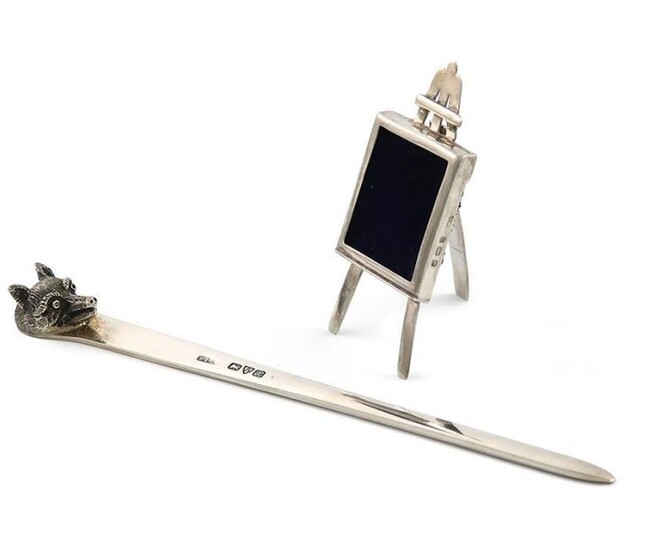 An Edwardian miniature silver easel photograph frame, by Samuel Levi, Birmingham 1904, rectangular form, with an easel strut, height 6cm, plus a silver paper knife, by Stokes and Ireland, Chester 1921, approx. weight 0.8oz. (2)