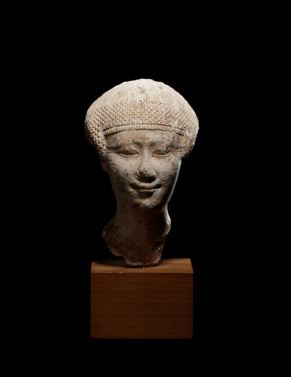 An Egyptian Limestone Head of a Noblewoman