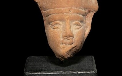 An Egyptian Terra Cotta Head of Horus
