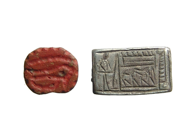 An Egyptian silver plaque and amulet