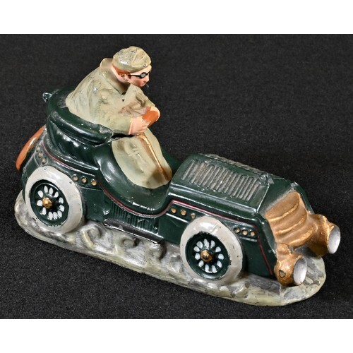 An early 20th century diecast novelty inkwell, cast as a gen...