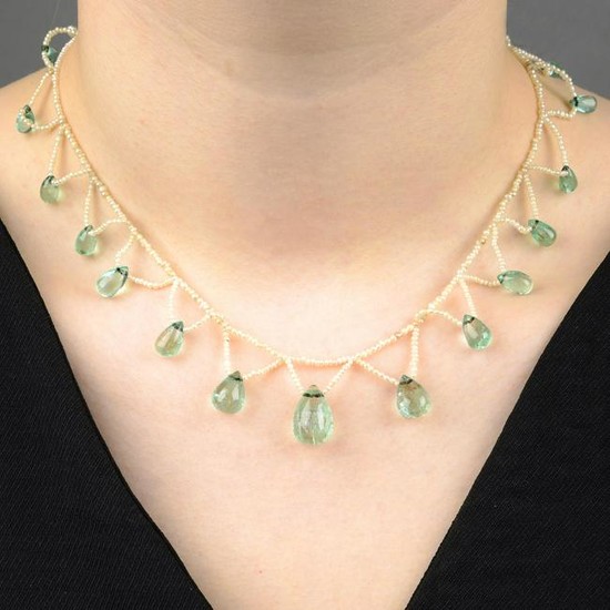 An early 20th century green beryl and seed pearl fringe